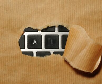 A piece of cardboard with a keyboard appearing through it